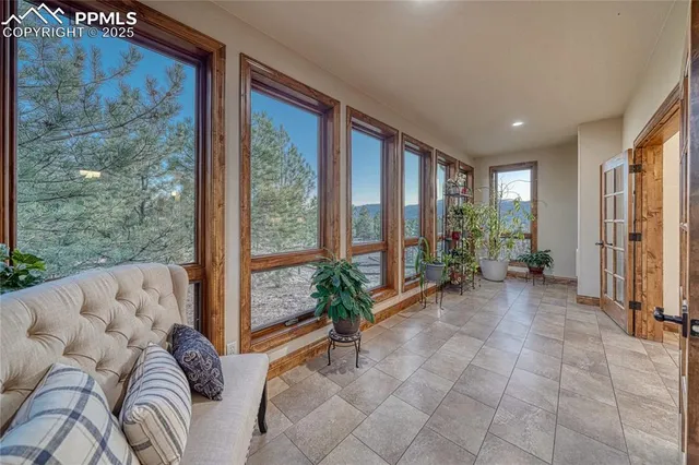 a living room with furniture and windows