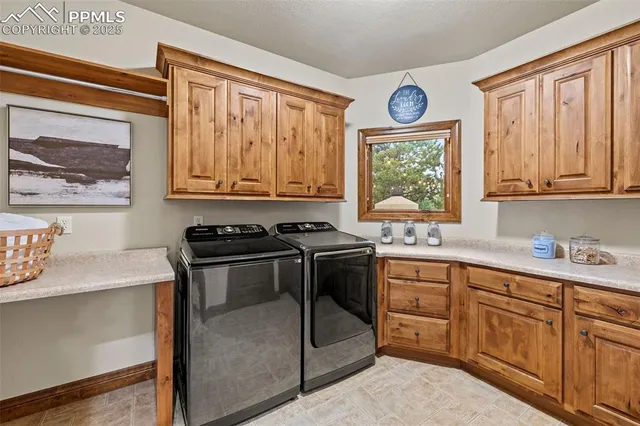 a kitchen with a stove a sink and a window