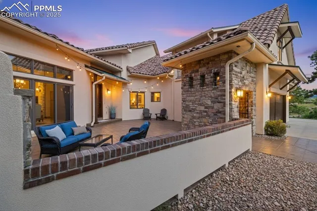 a view of a house with sitting area and furniture