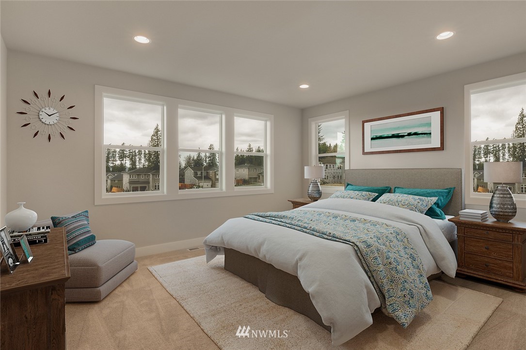 21819 33rd Drive Southeast, Unit 29 Bothell, WA 98021 - Photo 13 of 25 a bedroom with a bed and wooden floor