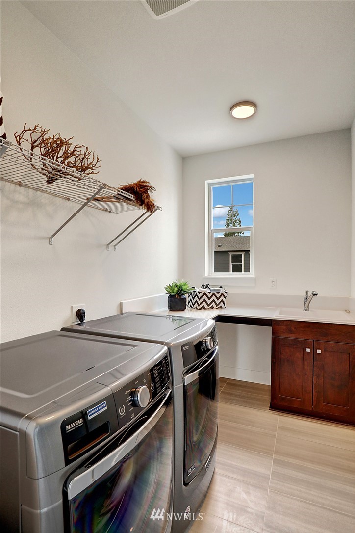 21819 33rd Drive Southeast, Unit 29 Bothell, WA 98021 - Photo 21 of 25 a kitchen with a stove and a sink