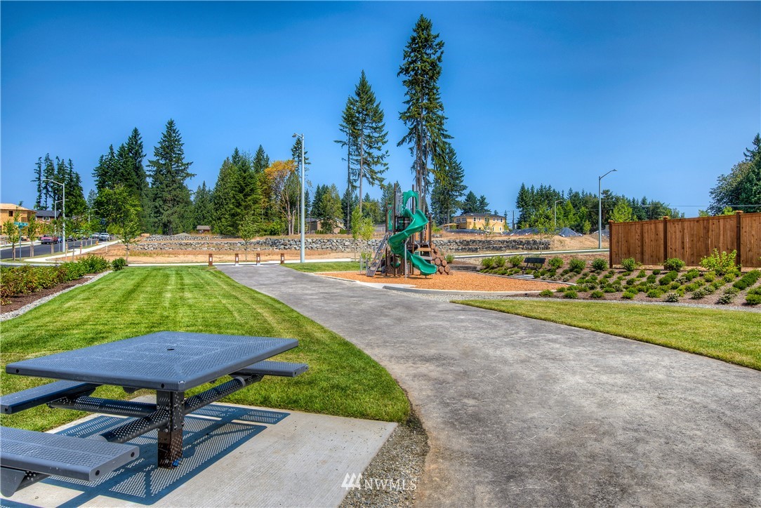 21819 33rd Drive Southeast, Unit 29 Bothell, WA 98021 - Photo 24 of 25 a view of swimming pool with a table and chairs