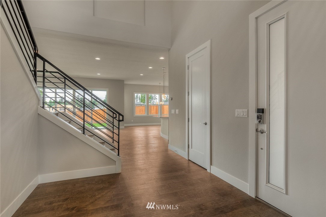 21819 33rd Drive Southeast, Unit 29 Bothell, WA 98021 - Photo 4 of 25 a view of entryway and hall with wooden floor