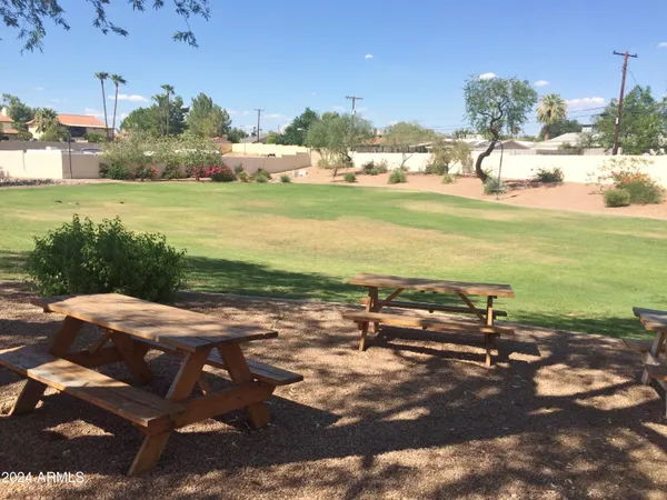 a view of a lake with beach and outdoor space