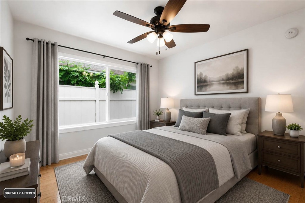 10539 Gridley Road Santa Fe Springs, CA 90670 - Photo 14 of 29 a bedroom with a large bed and a window