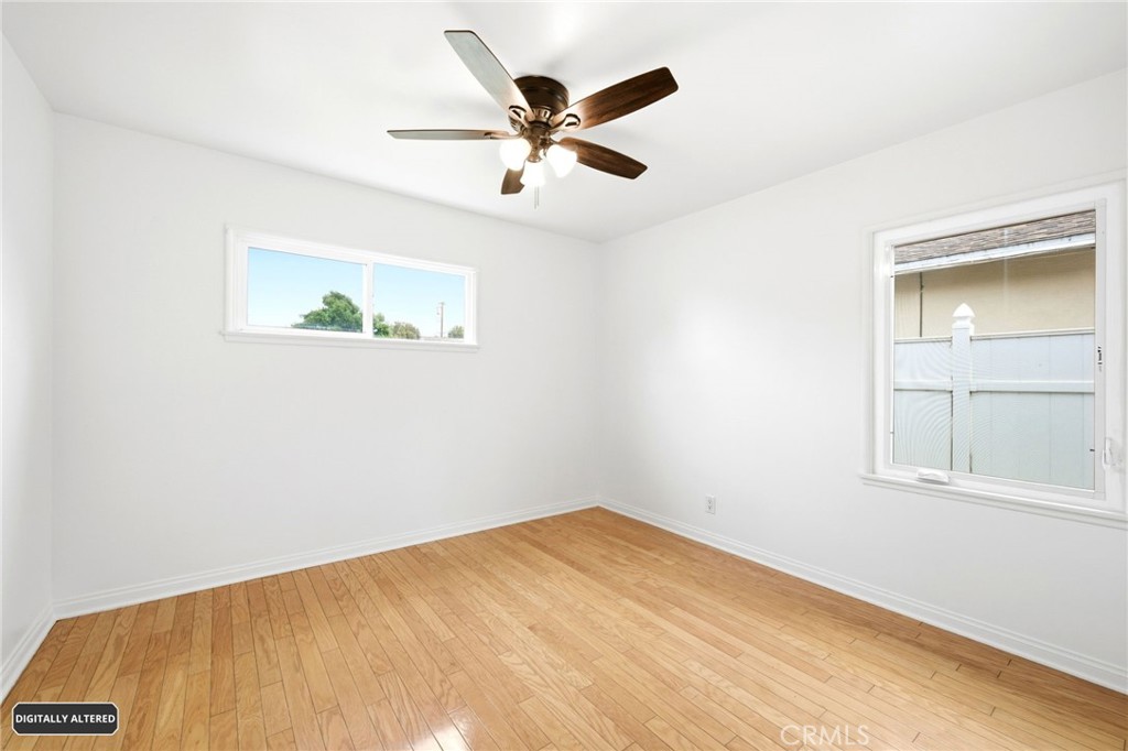 10539 Gridley Road Santa Fe Springs, CA 90670 - Photo 18 of 29 an empty room with a window and a ceiling fan