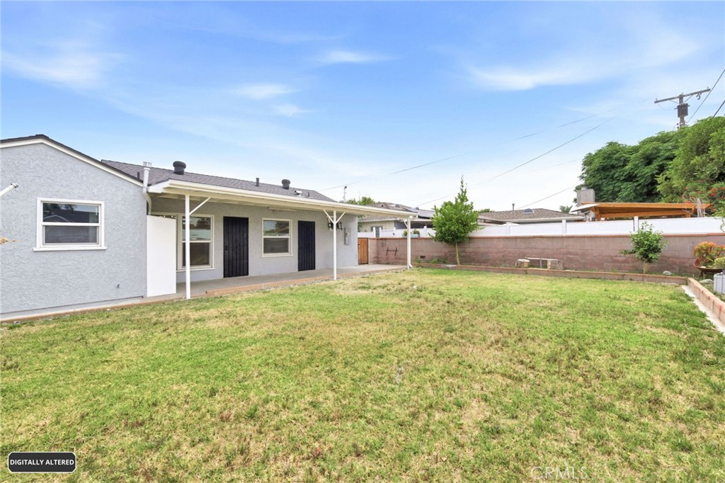 10539 Gridley Road Santa Fe Springs, CA 90670 - Photo 25 of 29 a view of a house with backyard and garden