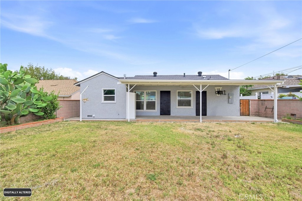10539 Gridley Road Santa Fe Springs, CA 90670 - Photo 26 of 29 a view of a house with backyard and garden