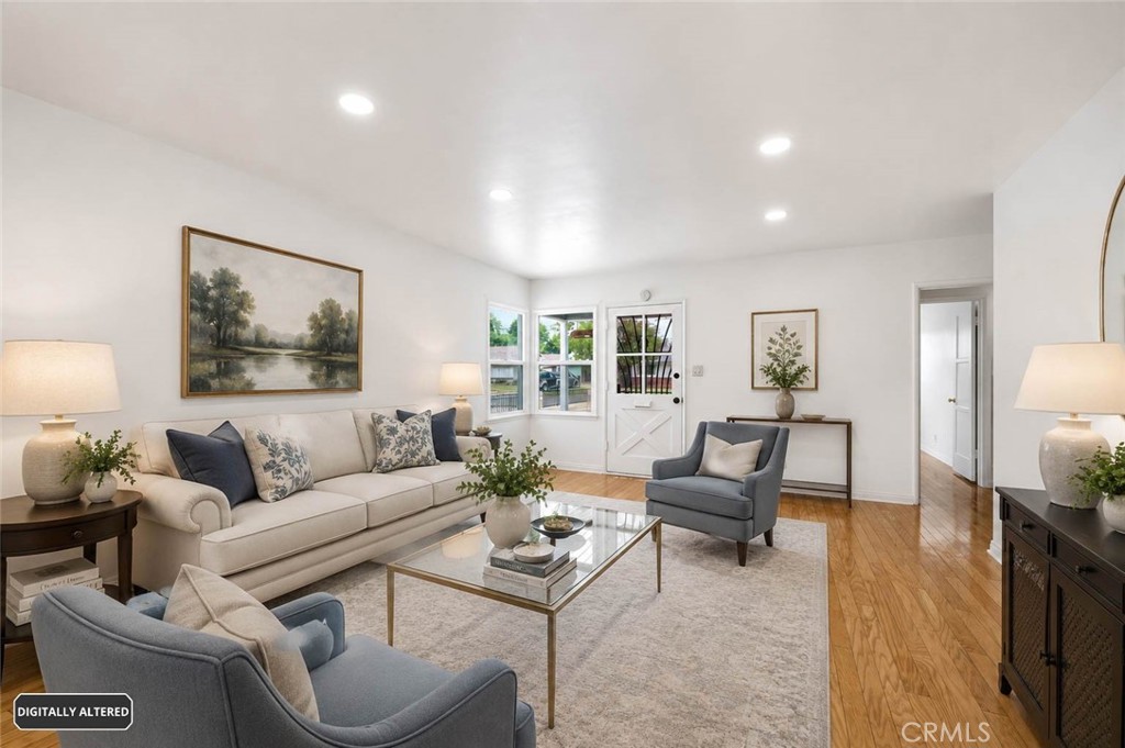 10539 Gridley Road Santa Fe Springs, CA 90670 - Photo 3 of 29 a living room with furniture and wooden floor