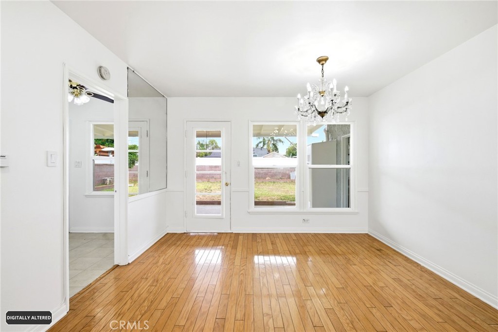 10539 Gridley Road Santa Fe Springs, CA 90670 - Photo 9 of 29 wooden floor in an empty room with a window