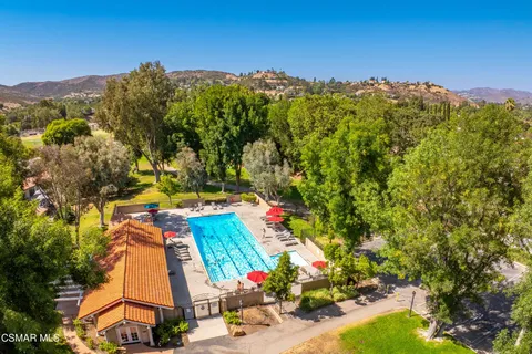 an aerial view of a houses with a yard
