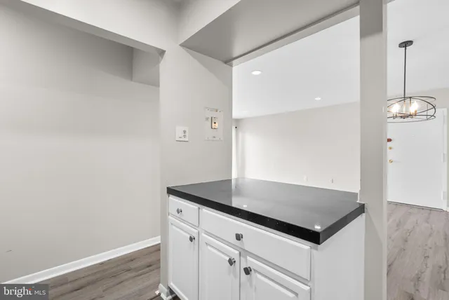 a view of kitchen island with wooden floor