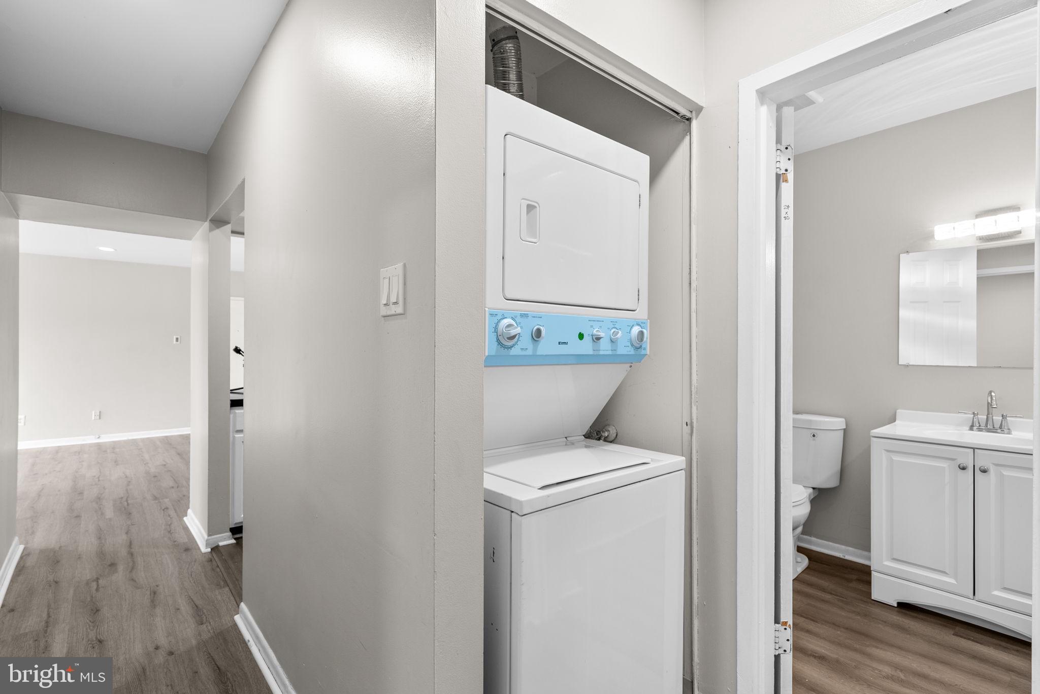 10121 Prince Place, Unit 30210B Upper Marlboro, MD 20774 - Photo 20 of 24 a view of bathroom with a toilet sink and mirror