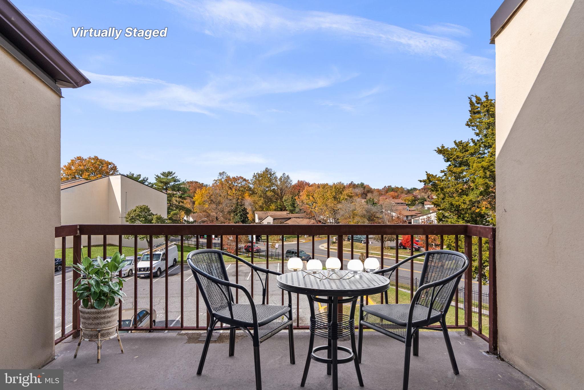 10121 Prince Place, Unit 30210B Upper Marlboro, MD 20774 - Photo 22 of 24 a view of a balcony with chairs