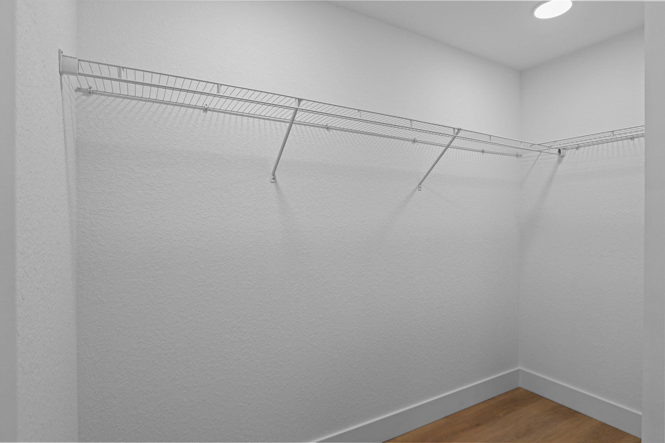 4611 Sunset Boulevard Fort Pierce, FL 34982 - Photo 15 of 28 a view of a room with racks on the wall