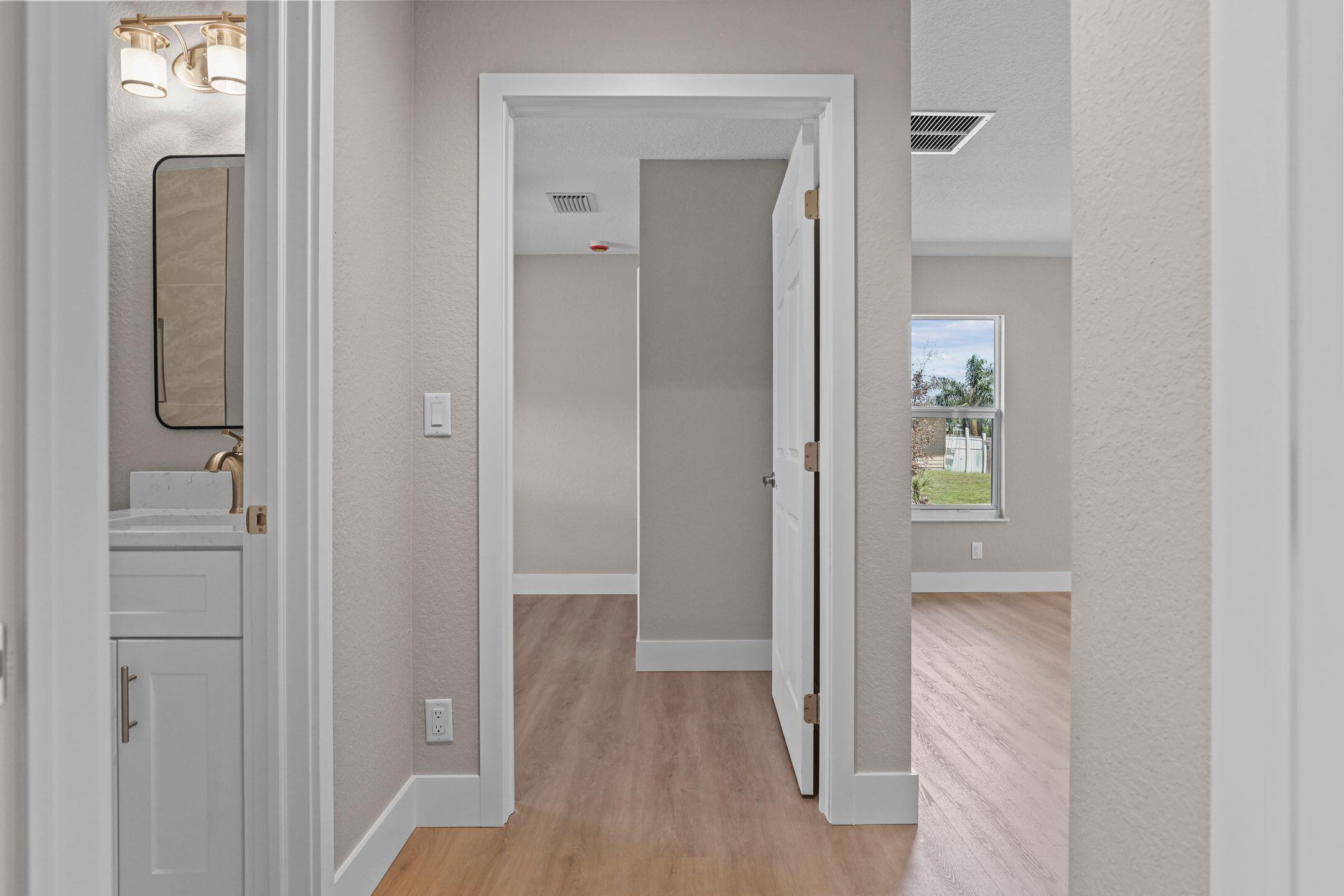 4611 Sunset Boulevard Fort Pierce, FL 34982 - Photo 23 of 28 a view of hallway with wooden floor
