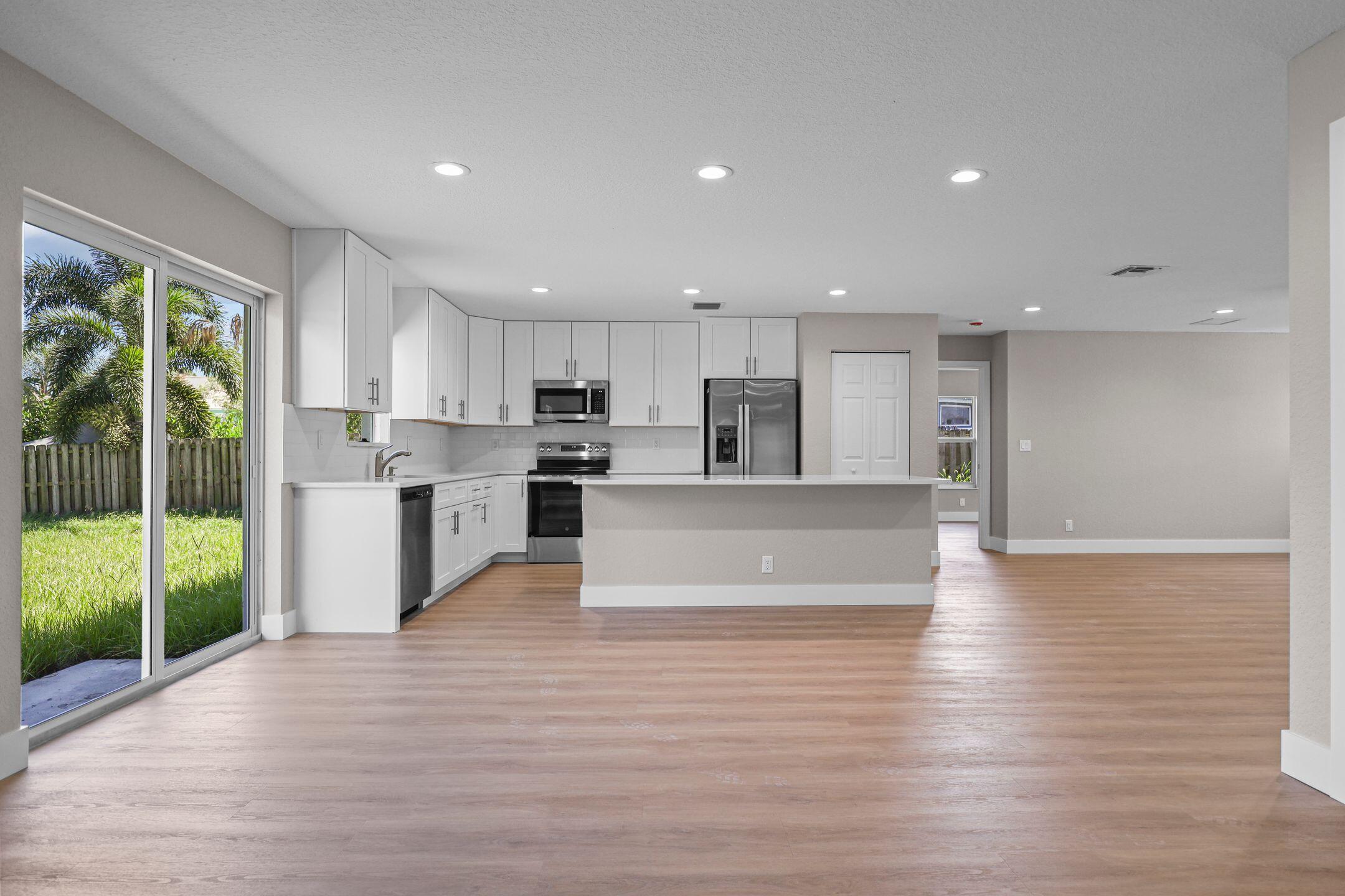 4611 Sunset Boulevard Fort Pierce, FL 34982 - Photo 9 of 28 a view of kitchen with wooden floor