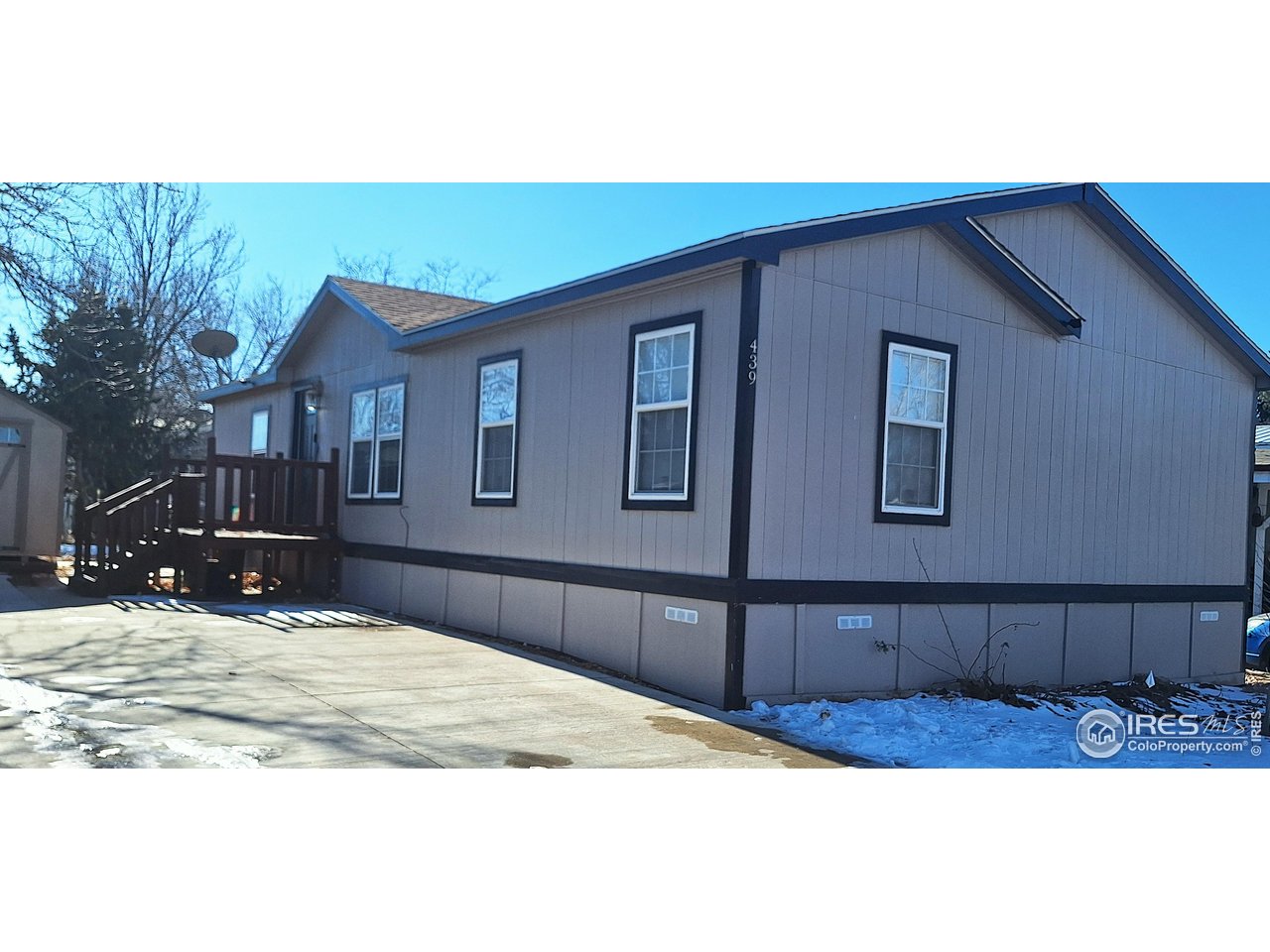 a view of a house with snow on the road