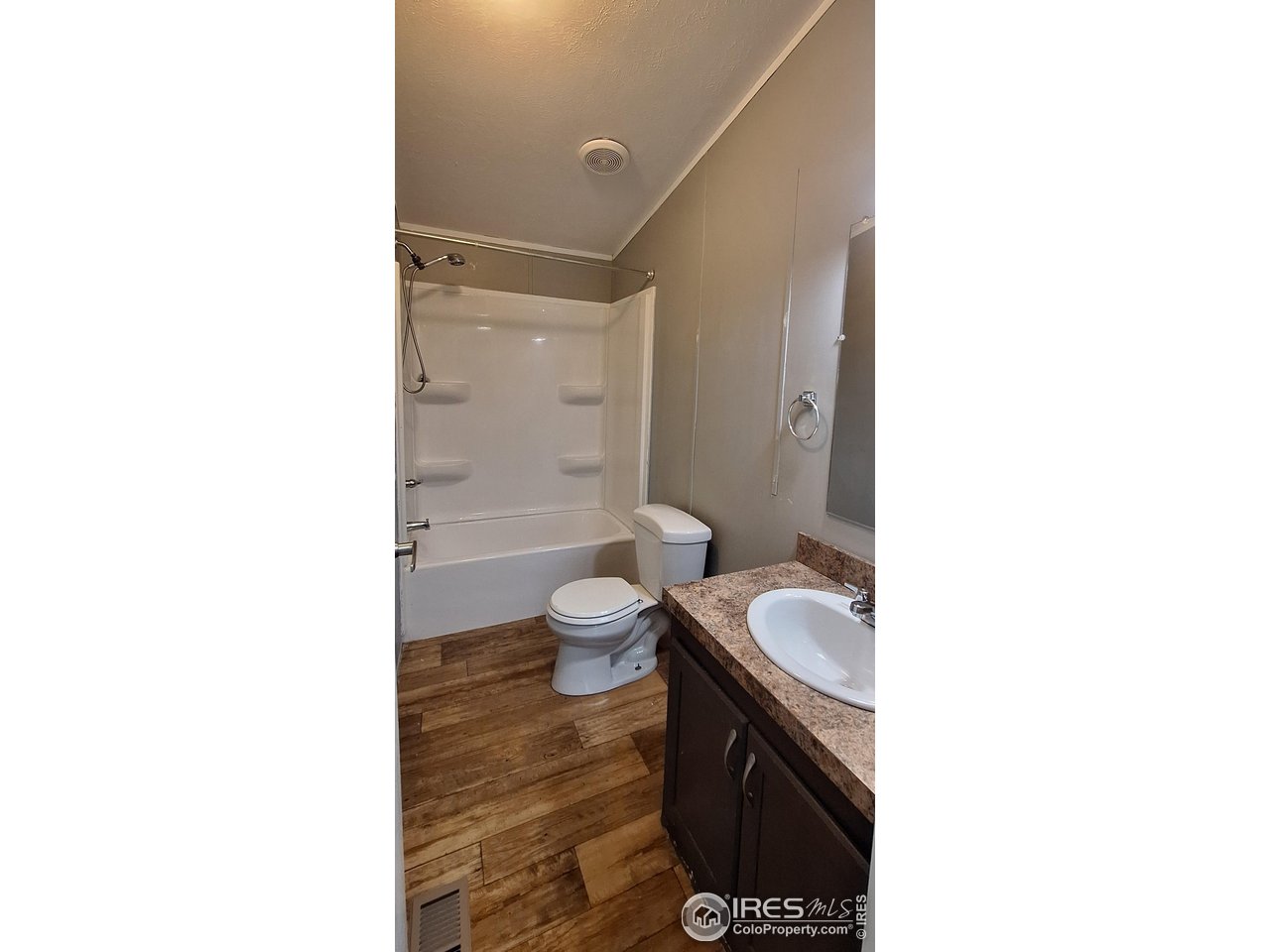 2500 East Harmony Road, Unit 439 Fort Collins, CO 80528 - Photo 12 of 13 a bathroom with a sink a toilet and shower