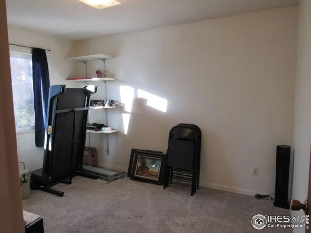 a room with furniture and a flat screen tv