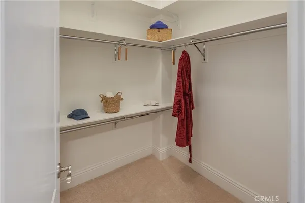 a bedroom with a bed and a desk