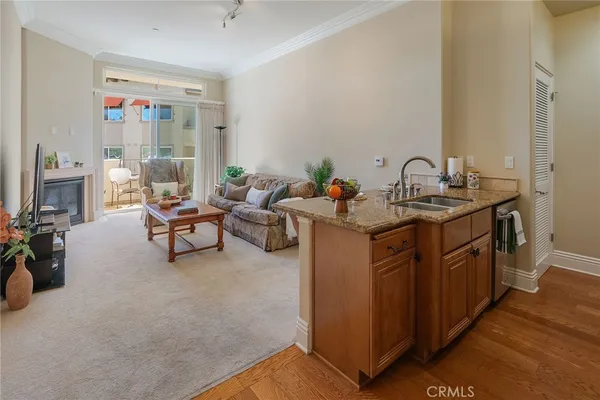 a kitchen with a granite countertop sink and a granite counter top