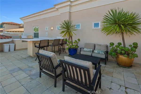 a view of a patio with table and chairs