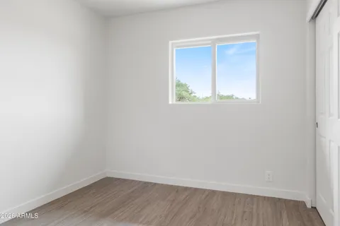 an entryway with wooden floor