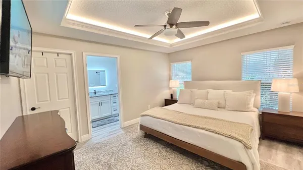 a bedroom with a bed and a couch