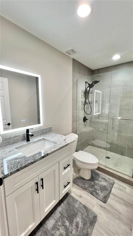6944 Southwest 179th Ave Road Dunnellon, FL 34432 - Photo 15 of 19 a bathroom with a granite countertop toilet sink and mirror
