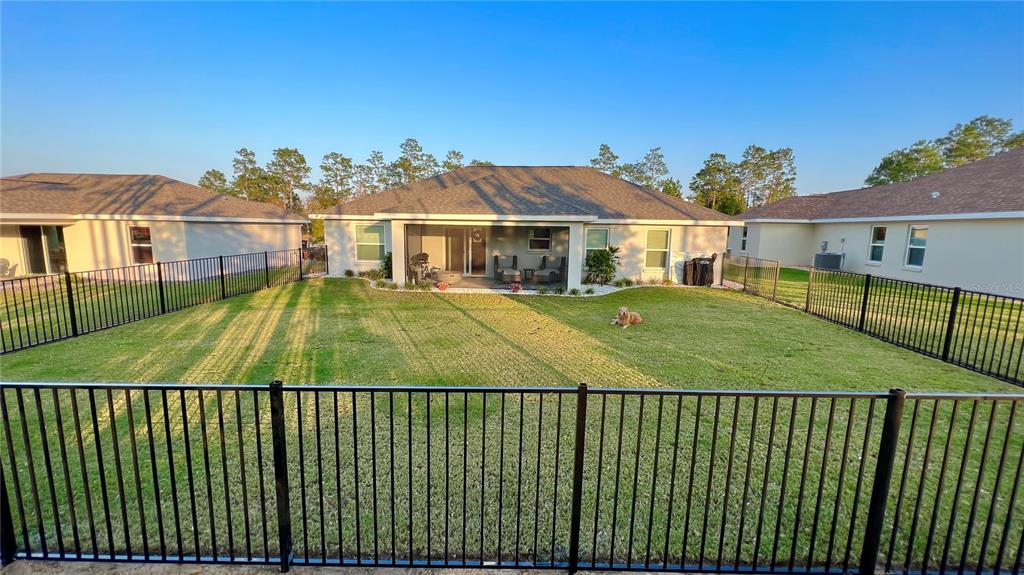6944 Southwest 179th Ave Road Dunnellon, FL 34432 - Photo 2 of 19 a view of a white house with a swimming pool