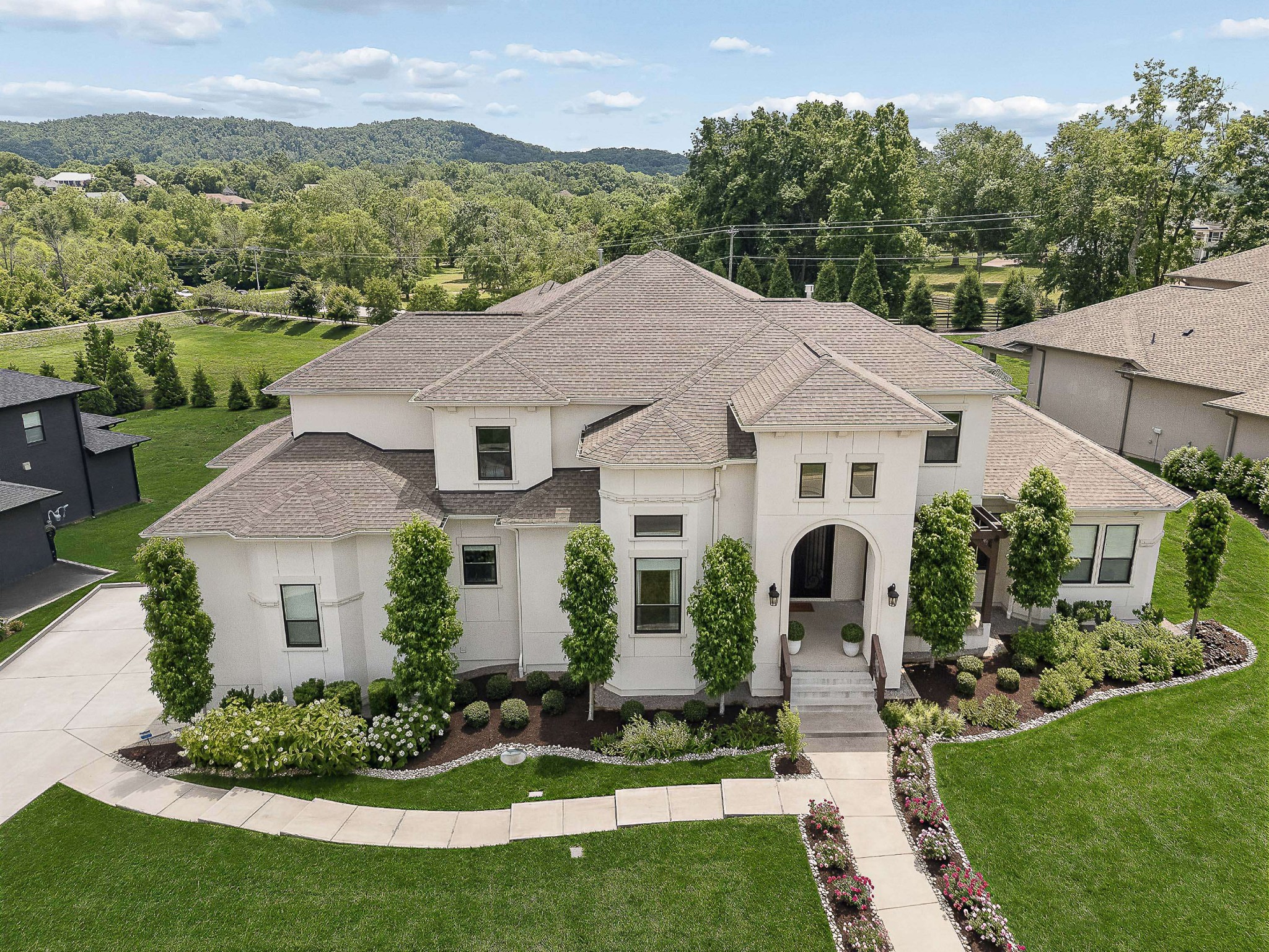 6004 Lookaway Circle Franklin, TN 37067 - Photo 2 of 71 a aerial view of a house with a yard and potted plants
