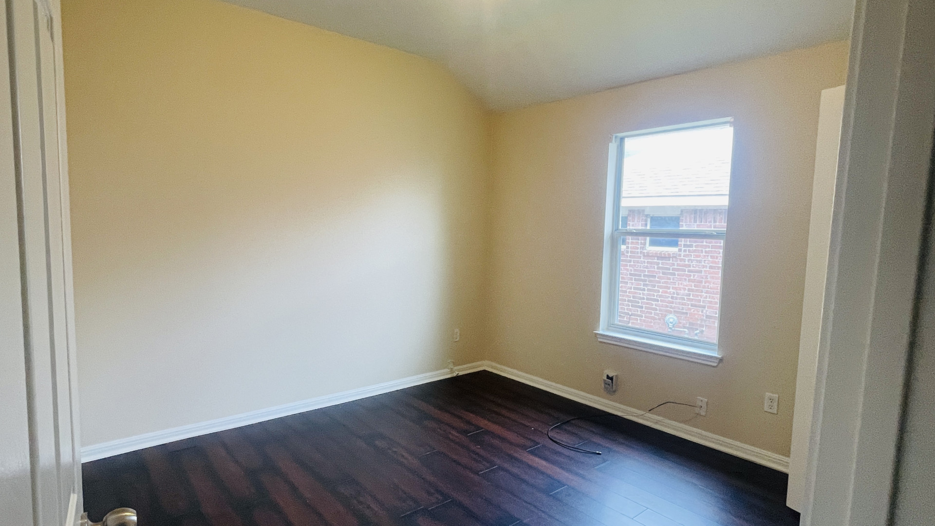 6805 Cromarty Lane Austin, TX 78754 - Photo 16 of 18 an empty room with wooden floor and windows