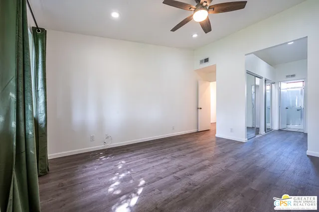 a bathroom with a double vanity sink and mirror with shower