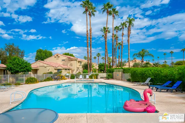 a view of a swimming pool with a patio