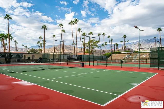 a view of a lake with a house in background