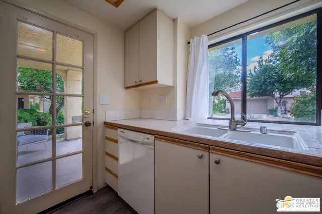 a kitchen with a stove microwave and refrigerator