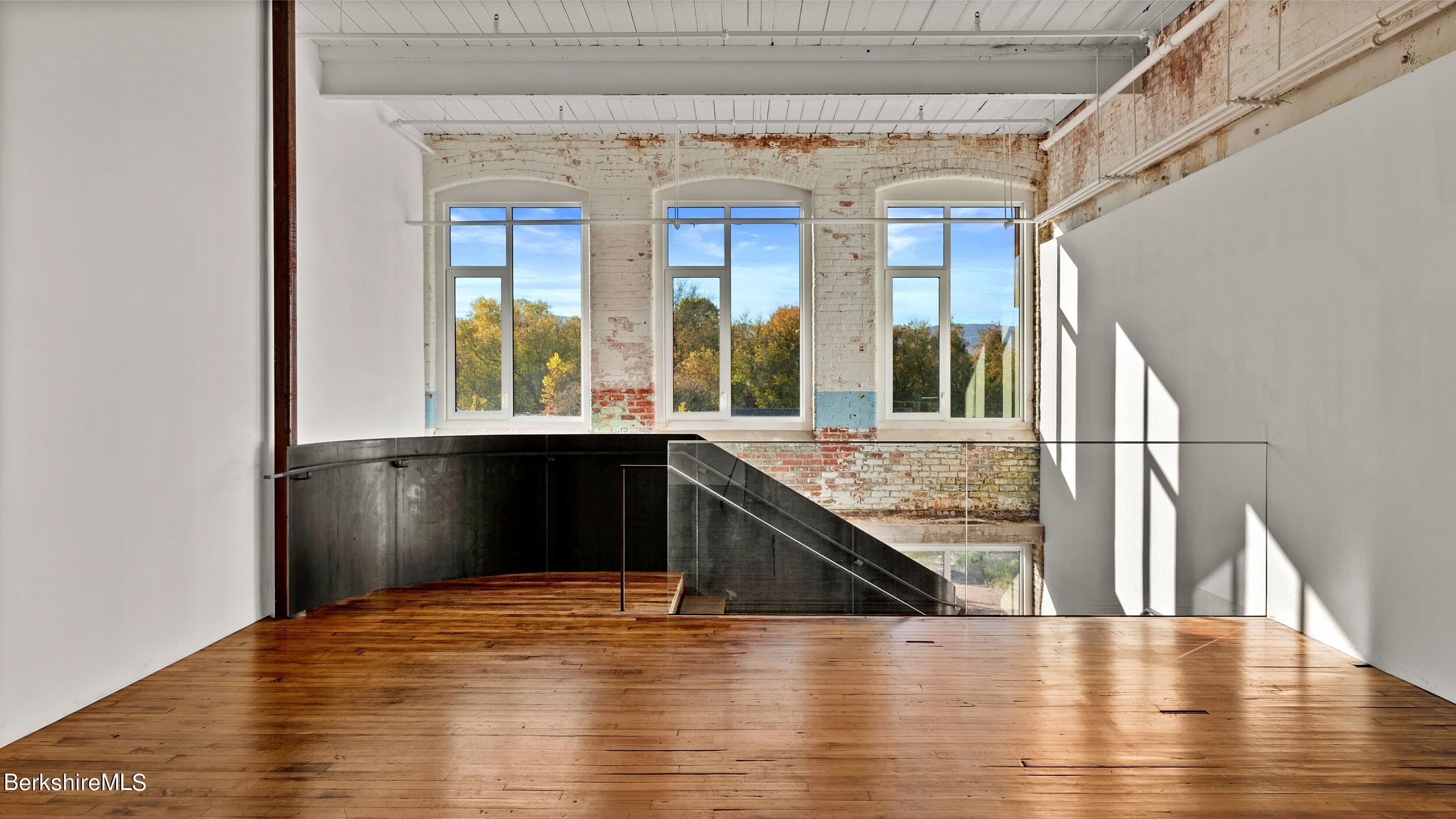 520 State Road, Unit 305 North Adams, MA 01247 - Photo 4 of 27 a view of a kitchen with a sink and a large window