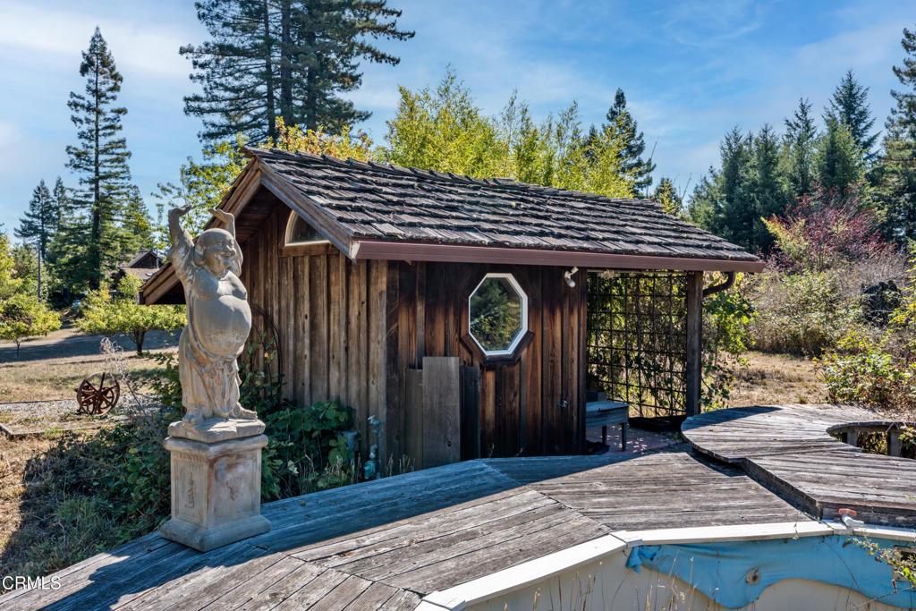 28580 Comptche Ukiah Road Comptche, CA 95427 - Photo 20 of 56 a view of a wooden door with a bench in a patio