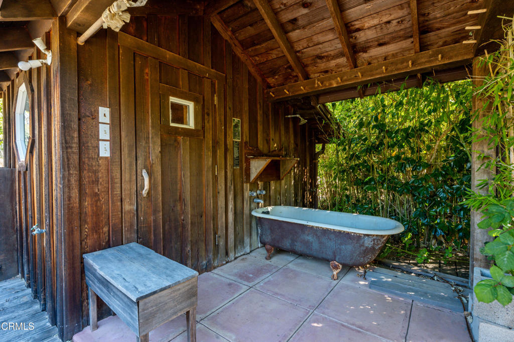 28580 Comptche Ukiah Road Comptche, CA 95427 - Photo 21 of 56 a wooden bench sitting in front of a building