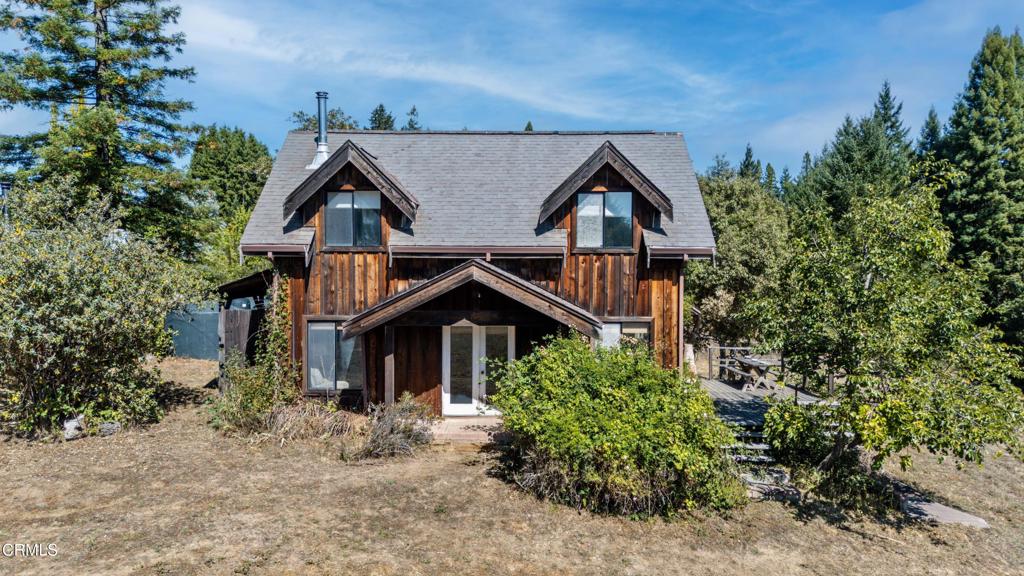 28580 Comptche Ukiah Road Comptche, CA 95427 - Photo 22 of 56 a front view of a house with a yard and trees