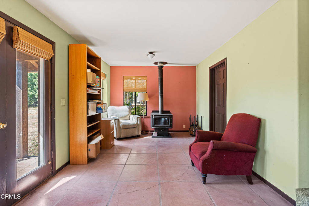 28580 Comptche Ukiah Road Comptche, CA 95427 - Photo 23 of 56 a living room with furniture and a floor to ceiling window