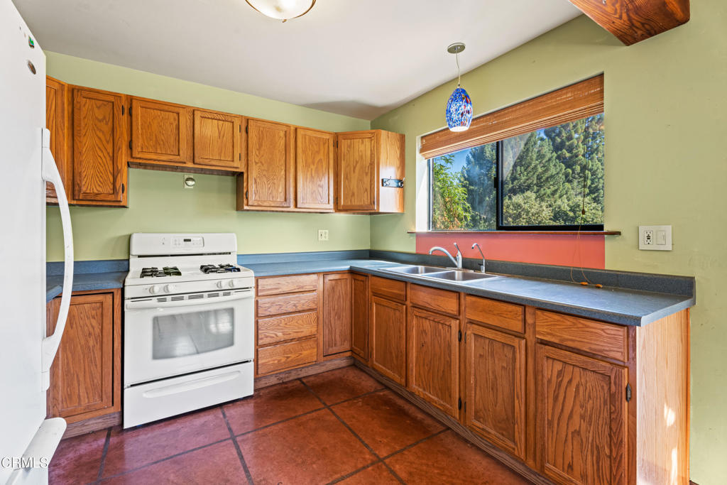 28580 Comptche Ukiah Road Comptche, CA 95427 - Photo 25 of 56 a kitchen with stainless steel appliances granite countertop a sink and a stove