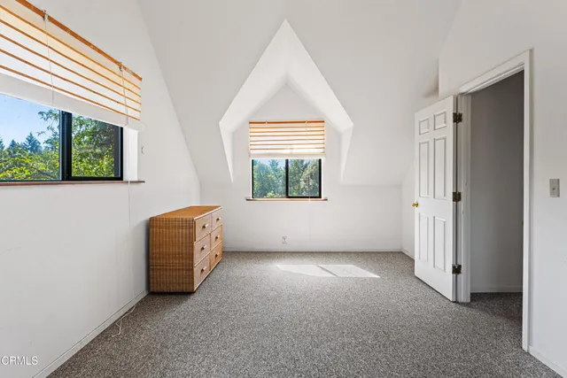 a house with trees in the background