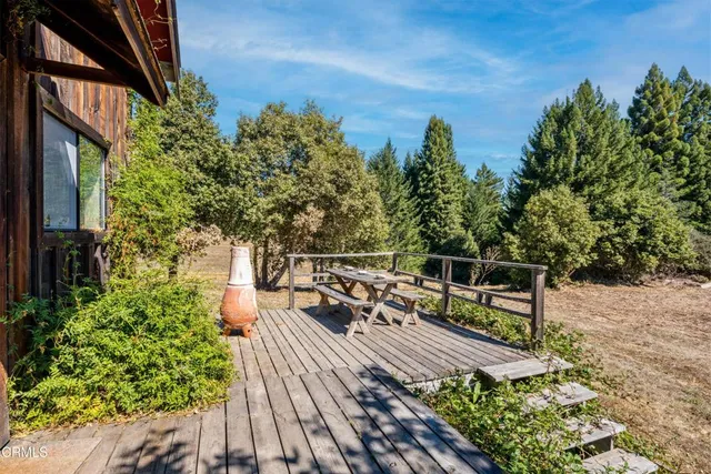 a view of a balcony with wooden floor