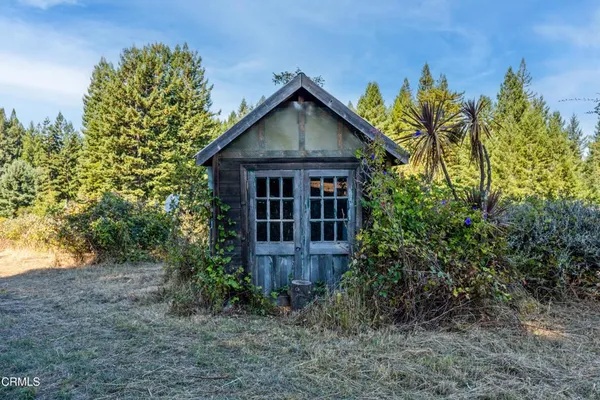 a view of room with window and cabinet