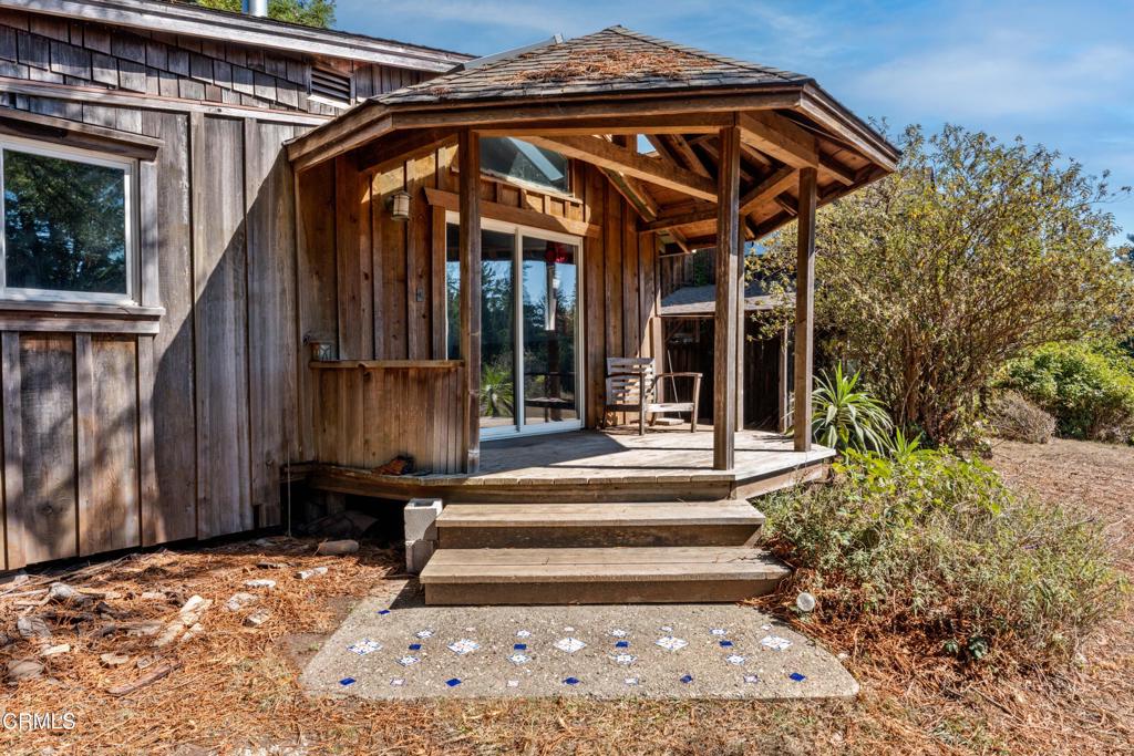 28580 Comptche Ukiah Road Comptche, CA 95427 - Photo 32 of 56 a view of a house with a small yard plants and large tree