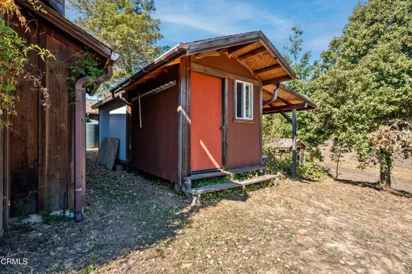 a view of a lush green hillside and a mountain view