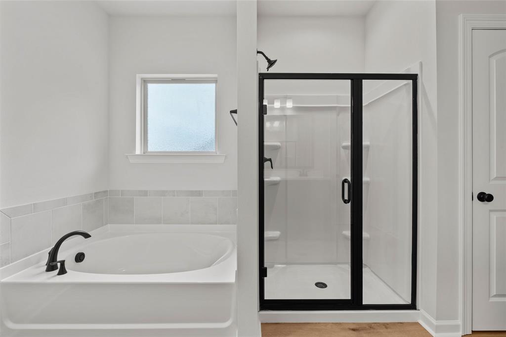 1269 BAYOU BAY Court Frierson, LA 71027 - Photo 21 of 30 a bathroom with a tub and a shower
