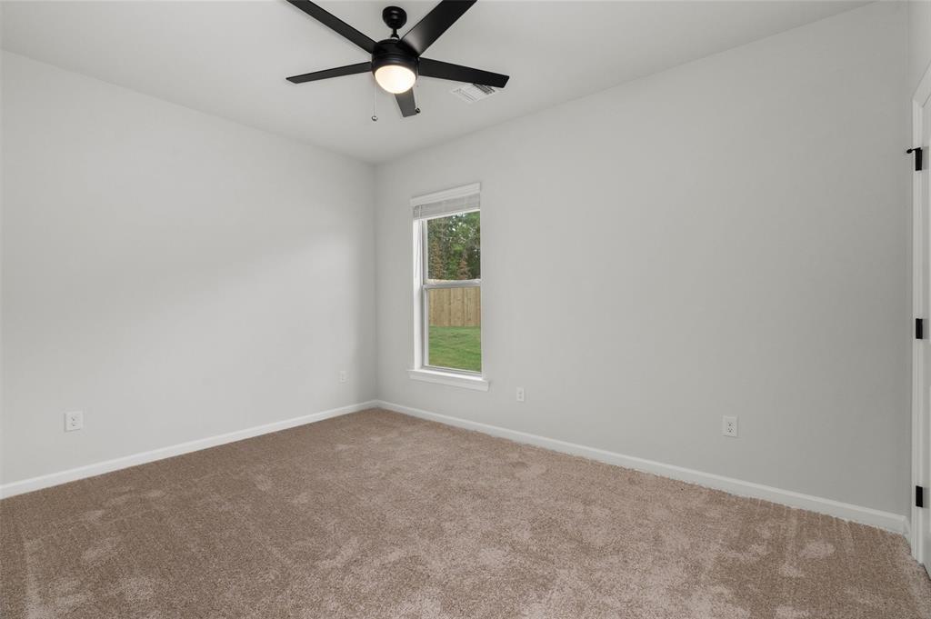 1269 BAYOU BAY Court Frierson, LA 71027 - Photo 23 of 30 an empty room with a window and a fan